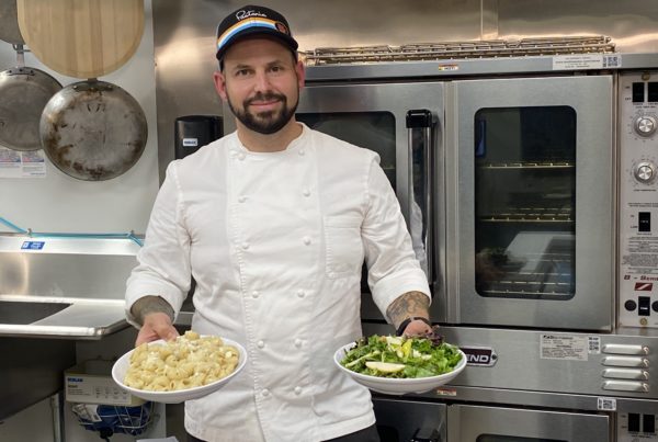 Chef Gerard Craft displays the pasta and salad dishes he created.